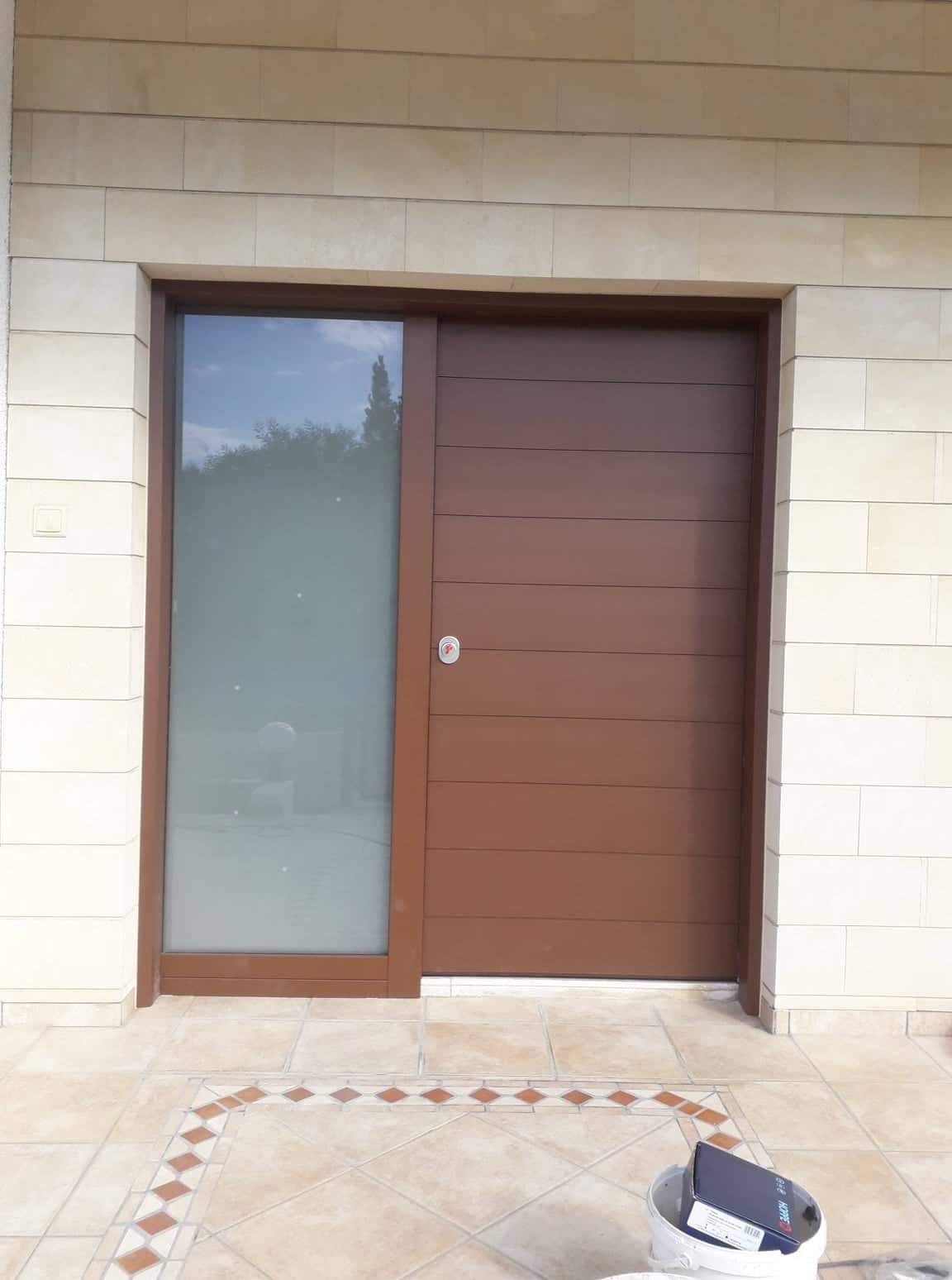 Timber door with narrow glazed sidelight