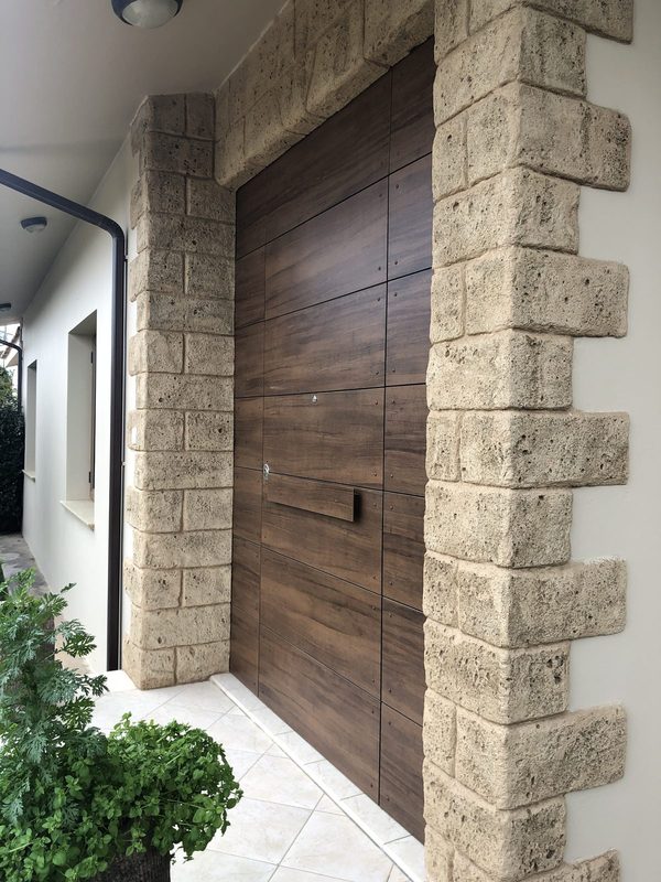Timber gate recessed into stonework