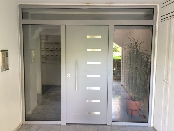 Glazed entrance screen with sidelights